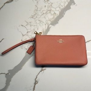 Large women’s wallet by Coach. Blush pink